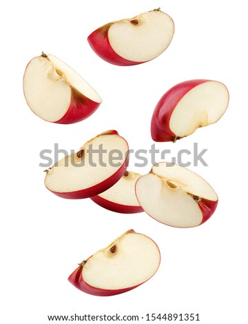 Falling Red apple slice isolated on white background, clipping path, full depth of field