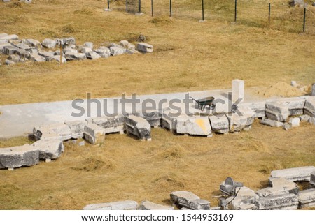 Top view of the excavation site in the ruined ancient city of Hierapolis. The remains of destroyed buildings and columns.