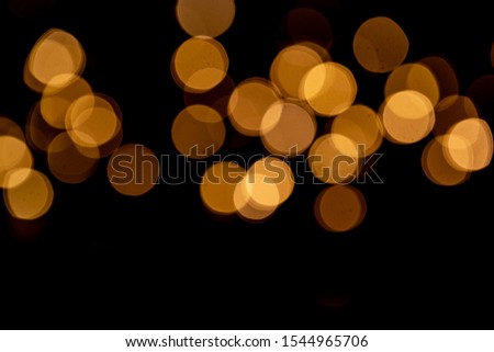 Abstract Christmas golden background. Blurred New year garlands lights