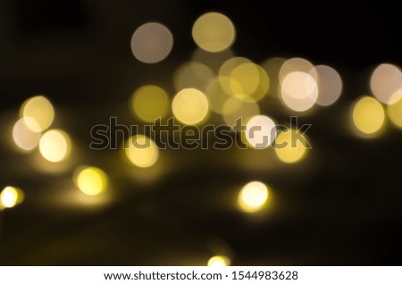 burning colored lights garlands on the background, blurred, out of focus, bokeh