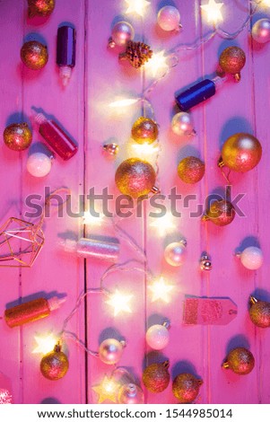 Christmas top view decoration, christmas baibles with string of light starry shaped, flat lay composition on a rustic board with colored gel used to change color and mood, christmas conceptal photo.
