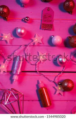 Christmas top view decoration, christmas baibles with string of light starry shaped, flat lay composition on a rustic board with colored gel used to change color and mood, christmas conceptal photo.
