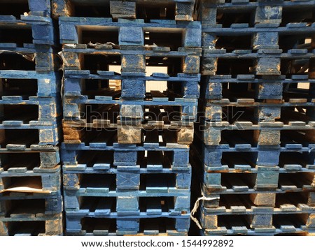 wooden pallets in stock, winter snow on pallets