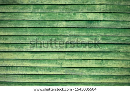 wall of obsolete green wooden boards, texture of vintage boards, general plan