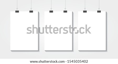 Realistic vector Three white blank A4 paper poster hanging on a rope with clip