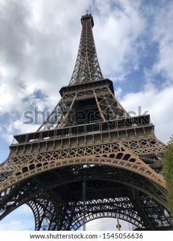 The Eiffel Tower in a sunny, cloudy summer, Paris, France
