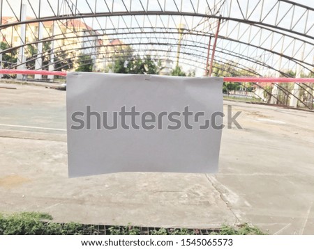 White paper hanging on a rope 