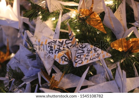A shot of paper origami on a Christmas tree