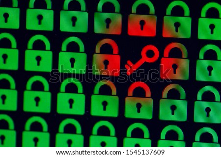 Key as a symbol of access or hacking of open personal information. Universal access password. Green pixel locks and a red key on a black background, close-up.