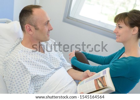 senior woman visiting husband in hospital