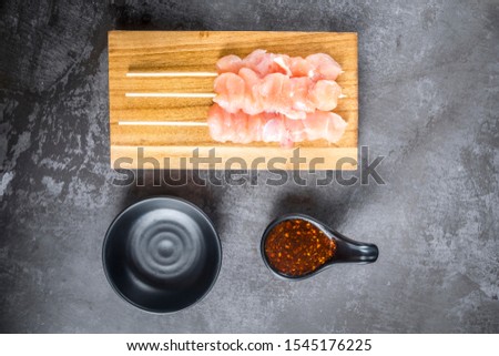 Spicy seasoning Sichuan chilli powder with Chicken sticks top view background