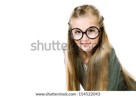 Portrait of a pretty ten years girl in big round spectacles. Isolated over white.