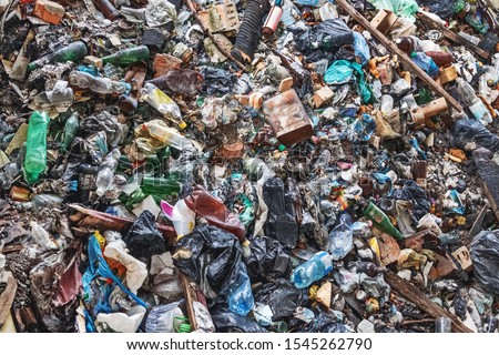 Background of garbage waste with a huge amount of used packaging from household products and food Royalty-Free Stock Photo #1545262790