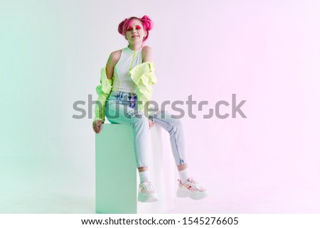 young woman looking at the camera girl model in stylish clothes