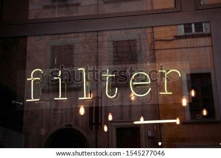 Filter neon letters on a glass