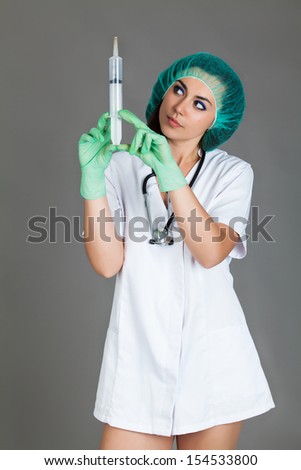 woman doctor on grey background
