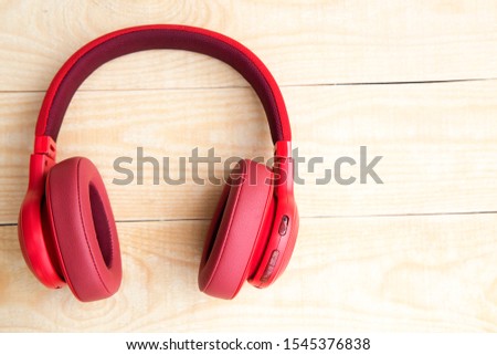 Headphones on a wooden background.Music concept
