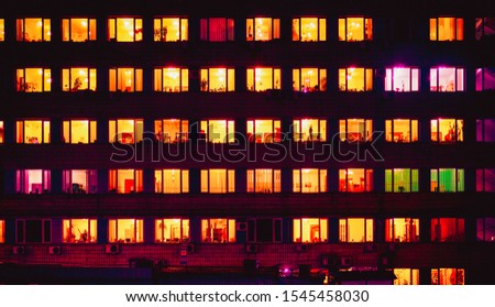 warm orange light inside night windows Royalty-Free Stock Photo #1545458030