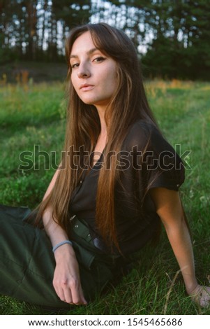 Portrait on green backdrop. Female fashion. Spring meadow. Fashion woman. Rural nature. Summer season. Sunny yellow background. Green farm.