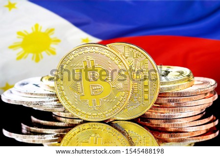 Concept for investors in cryptocurrency and Blockchain technology in the Philippines. Bitcoins on the background of the flag Philippines.