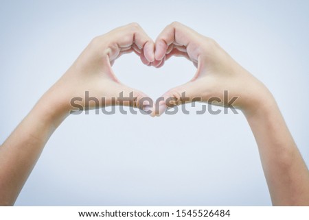 Empty hand making heart shape isolated on white background 