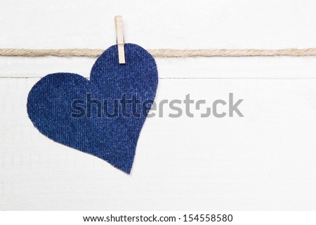 Denim heart hanging on string