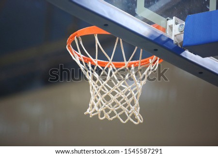 Low angle view of basketball hoop in court and blue shield