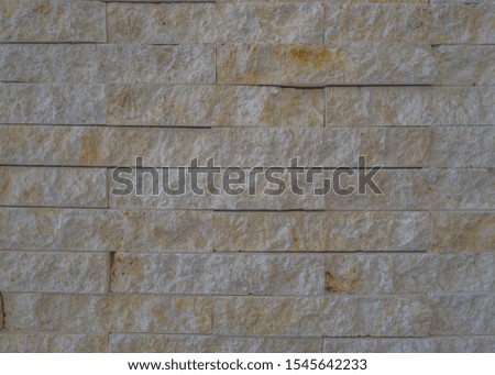 White and Yellow Sandstone Block Wall.  Close in view of colorful rock for use as an advertising backdrop.