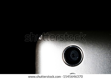 camera on a silver phone close-up on a black background
