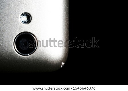 camera on a silver phone close-up on a black background