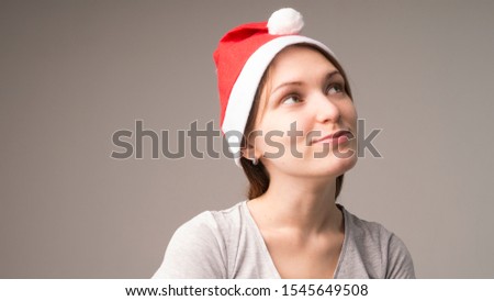 young girl in santa claus hat