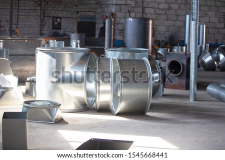 Workshop in the factory for the manufacture of ventilation pipes. Ventilation metal pipes.