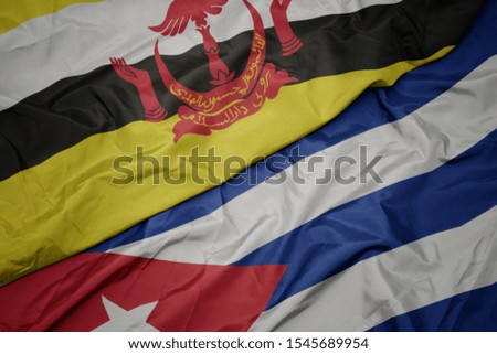 waving colorful flag of cuba and national flag of brunei. macro