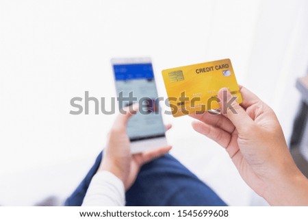 woman use smart phone and holding credit card with shopping online. Online payment concept.