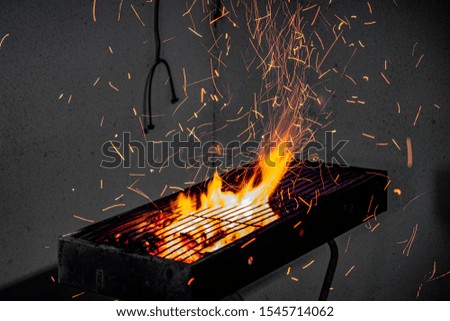 burning coal in a grill