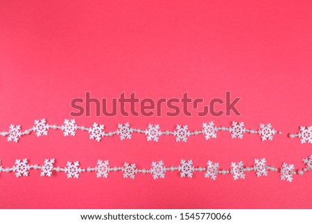 Christmas garland. Abstract  photo on pink background.