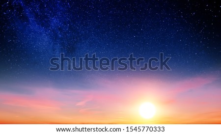 Sunset sky with orange setting sun and red clouds landscape against bright star on black universe background. Wide panorama view of stars in space nature at dark time. Starry night at night wallpaper Royalty-Free Stock Photo #1545770333