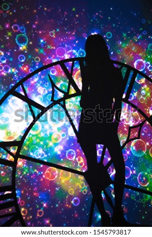 Shadow of woman and watch silhouette on abstract color background