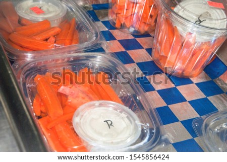 Carrot Sticks and Dip in Containers for Retail Sale