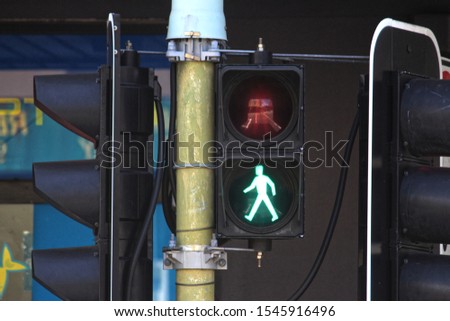 Suburban traffic lights with pedestrian lights showing green for walk. 