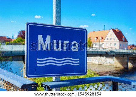 Modern blue Traffic road sign - River Mura safety construction symbol. Design element. Street information concept. Transportation board frame. Bad Radkersburg in Austria