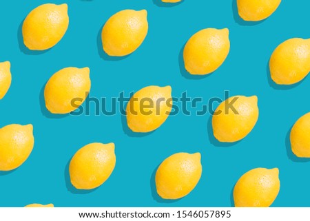 Lemon Fruit pattern. Colorful of fresh lemon texture slices on Blue background. From top view. Photography collage. Minimal summer fruits pattern - Image