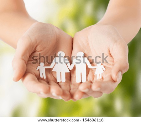 eco, bio, nature, love, harmony concept - woman cupped hands showing paper man family