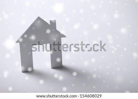 business and real estate concept - white paper house over white background