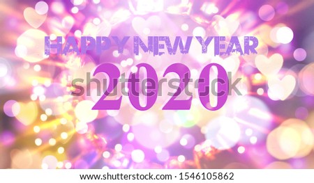 Happy New Year 2020 text on blurred background. Booke rings and stars. Decorated with various beautiful colors. In the jpeg format