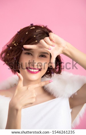 Beautiful asian woman isolated on pink background