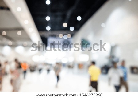 abstract blurred and defocused crowd people at public exhibition hall, Organization or company event, commercial trading, or shopping mall marketing advertisement concept