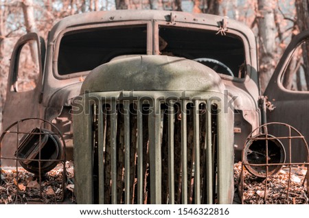 cabin of a rusty military army truck in the Chernobyl forest Ukraine close up