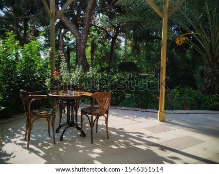 photo image of the cafe in the tropical garden