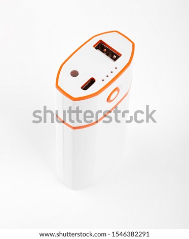 Power bank for charging mobile devices. Smart phone charger with power bank. Battery bank on a white background . External battery for mobile devices.
